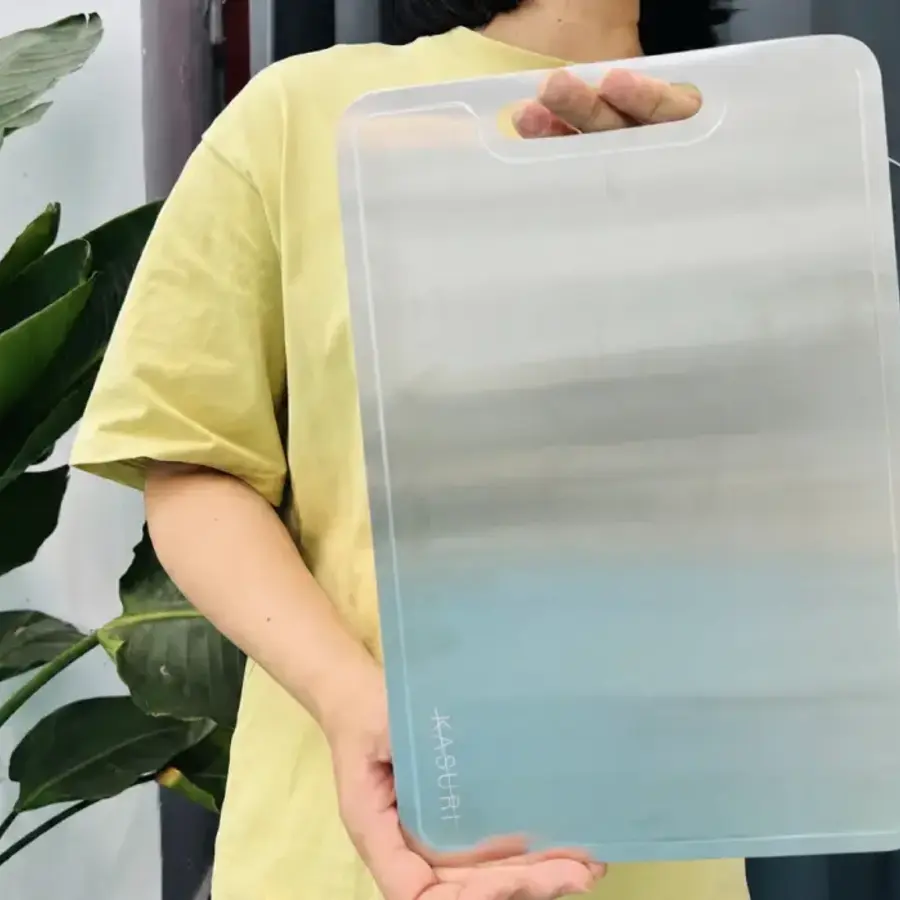 Sara holding a Kasuri cutting board